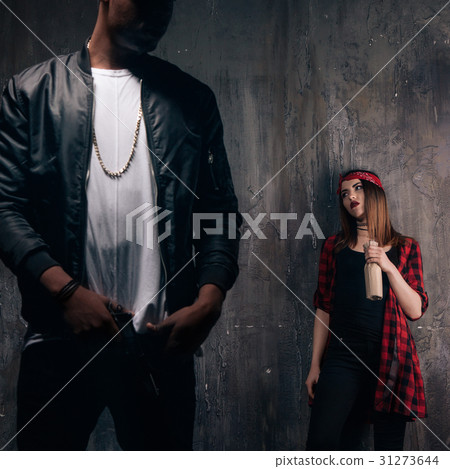 Criminal teenagers on dark background Criminal teenagers on dark background 31273644