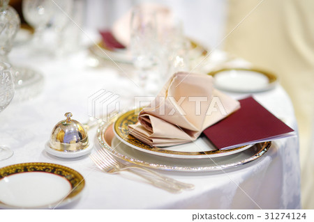 Beautiful table setting with crockery and flowers Beautiful table setting with crockery and flowers 31274124
