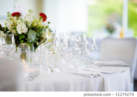 Beautiful table setting with crockery and flowers Beautiful table setting with crockery and flowers 31274279