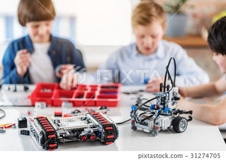 Ready made robots at table afore boys 31274705