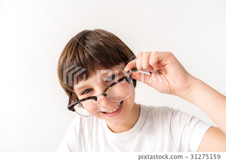 Happy smiling young male person keeping glasses 31275159