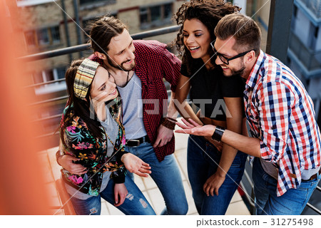 Happy friends talking and standing on steps Happy friends talking and standing on steps 31275498