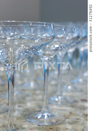 Lot of clear empty wine glasses on granite stone table. Lot of clear empty wine glasses on granite stone table. 31276892