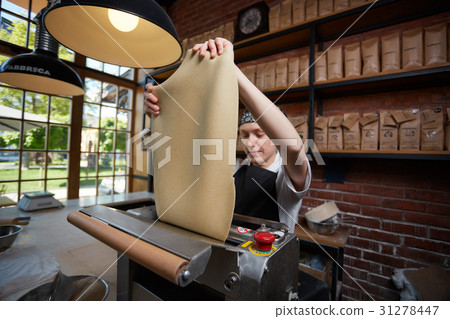 Female cook rolling dough Female cook rolling dough 31278447