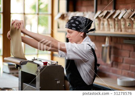 Woman preparing knead for pasta Woman preparing knead for pasta 31278576
