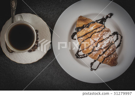 Croissant with chocolate and coffee Croissant with chocolate and coffee 31279997