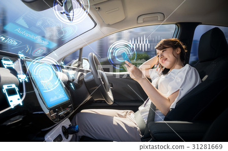 A woman riding in an automatic driving car A woman riding in an automatic driving car 31281669