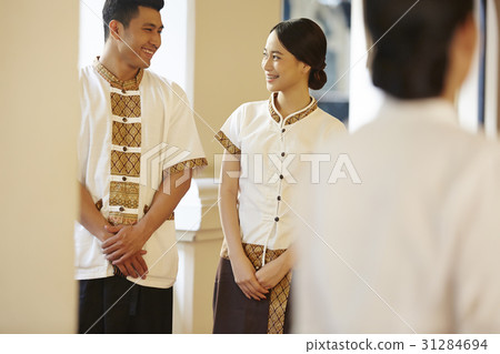 Two staff with hotel's uniform are chatting together 31284694