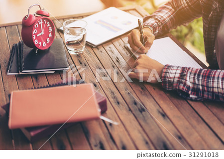 Businessman or freelance working on a desk 31291018