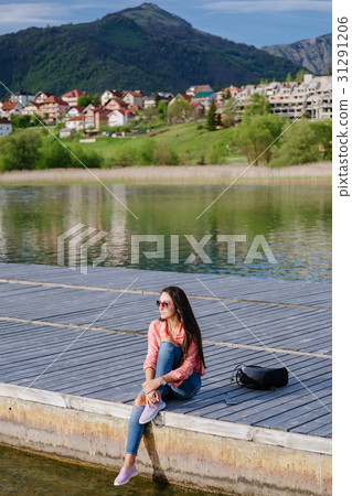 woman with smartphone backpacking in mountains woman with smartphone backpacking in mountains 31291206