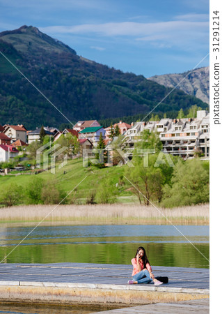 woman with smartphone backpacking in mountains woman with smartphone backpacking in mountains 31291214