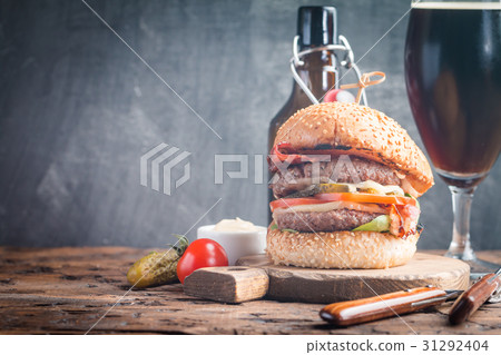 Hamburger and dark beer in vintage style 31292404