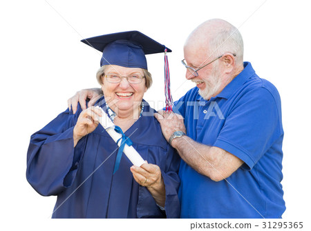 Senior Adult Woman Graduate in Cap and Gown Being Congratulated Senior Adult Woman Graduate in Cap and Gown Being Congratulated 31295365
