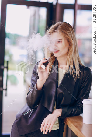 beautiful blonde in a cafe 31297359