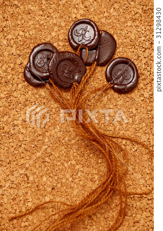 Seal of brown wax on the background surface bals Seal of brown wax on the background surface bals 31298430
