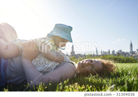 Mother play with child in the park Mother play with child in the park 31304036