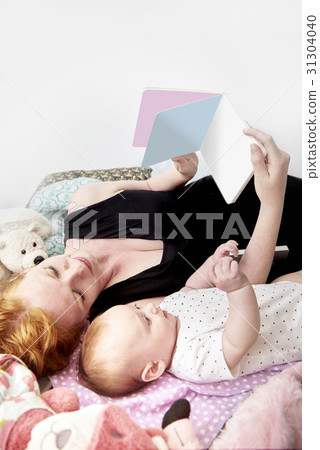Mother reading book to her child. Mother reading book to her child. 31304040