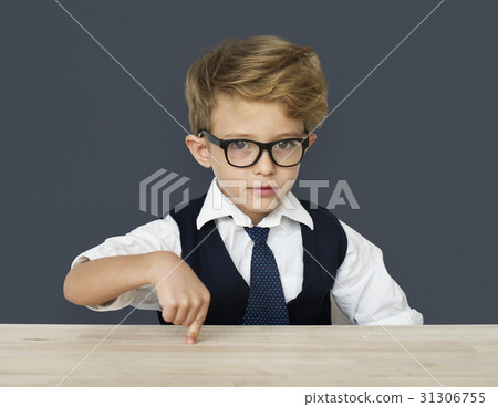 A Caucasian Boy Pointing Wooden Table Background Studio Portrait A Caucasian Boy Pointing Wooden Table Background Studio Portrait 31306755