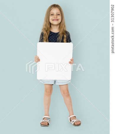 Little girl smiling and holding blank placard 31307902