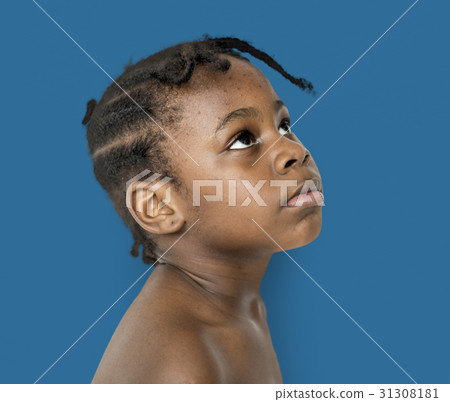 African Descent Boy Looks Up Focused Concentrated 31308181