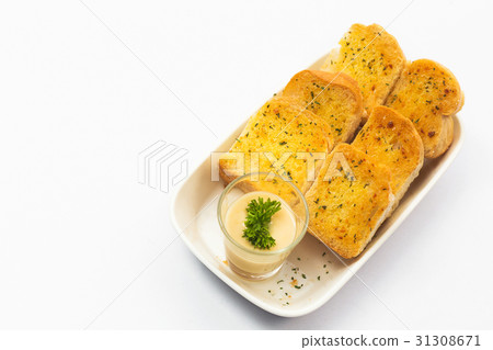 Garlic bread and herb bread slice on dish. Garlic bread and herb bread slice on dish. 31308671