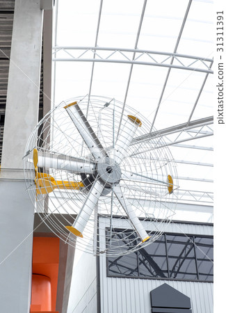 Big fan on post at departmentstore in summer time Big fan on post at departmentstore in summer time 31311391