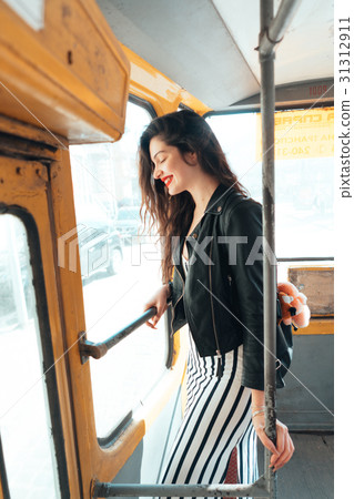 Woman traveling inside the tram 31312911