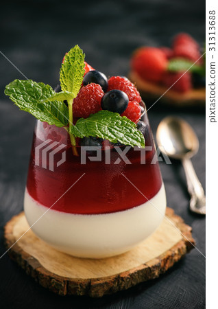 Dessert - panna cotta with berries and berry jelly Dessert - panna cotta with berries and berry jelly 31313688
