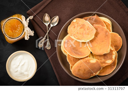 Homemade pancakes on black background. Homemade pancakes on black background. 31313707