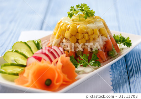 Aspic- jellied chicken with egg and vegetables. 31313708