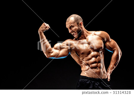 Strong bald bodybuilder with six pack. 31314328