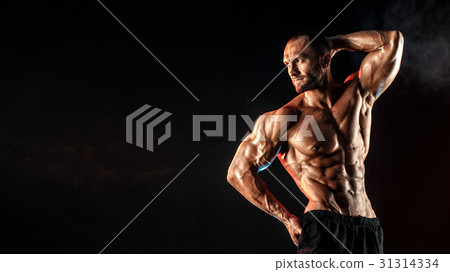 Strong bodybuilder man with perfect abs, shoulders Strong bodybuilder man with perfect abs, shoulders 31314334