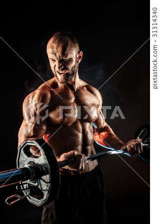 Hardy man doing exercise with heavy bar Hardy man doing exercise with heavy bar 31314340