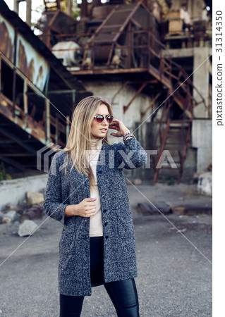 Portrait of a beautiful young woman in an Portrait of a beautiful young woman in an 31314350