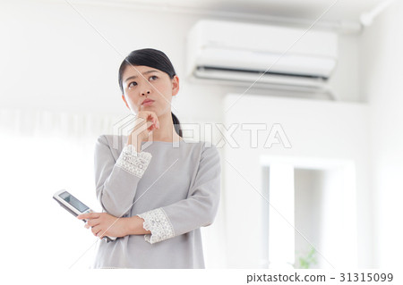 Air conditioner · troubled woman Air conditioner · troubled woman 31315099