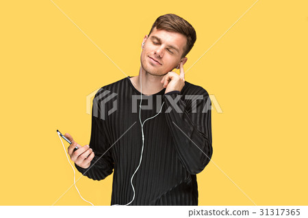 The young man smiling and looking away The young man smiling and looking away 31317365