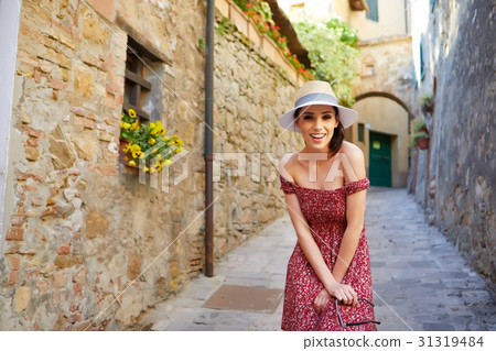 Fashionably dressed woman on the streets of a small Italian town Fashionably dressed woman on the streets of a small Italian town 31319484