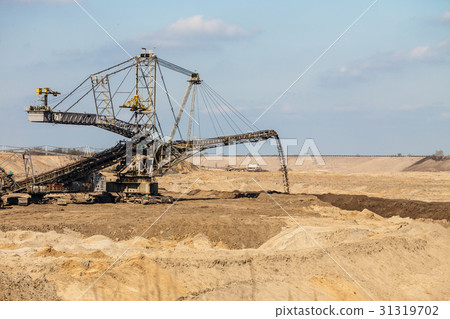 Opencast brown coal mine. Giant excavator. 31319702