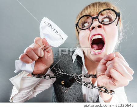 Furious woman with chained hands and contract 31320643