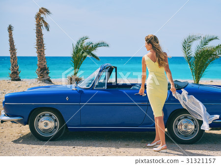 Woman near retro cabriolet car  31321157
