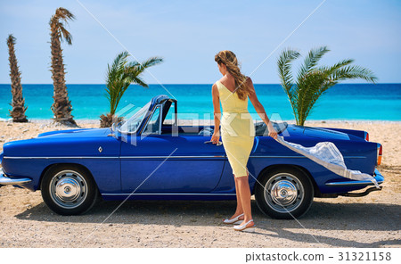 Woman near retro cabriolet car  31321158
