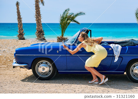 Woman near retro cabriolet car  31321160