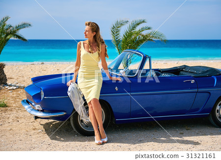 Woman near retro cabriolet car  31321161