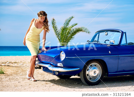 Woman near retro cabriolet car  31321164