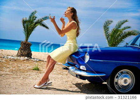 Woman near retro cabriolet car  31321166
