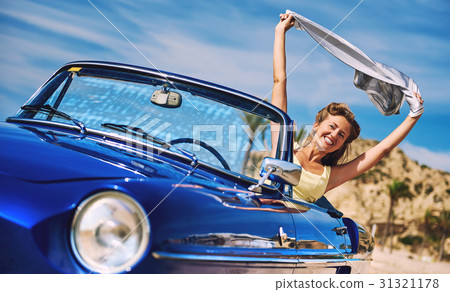 Woman near retro cabriolet car  31321178