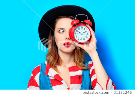 Woman with alarm clock 31321246