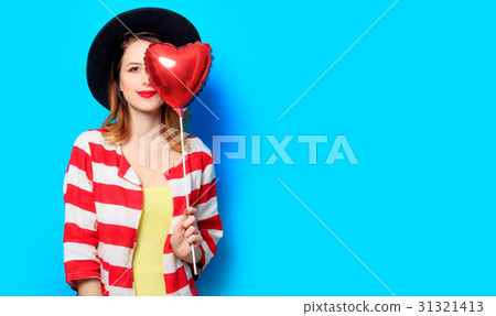 Woman with heart shape toy Woman with heart shape toy 31321413