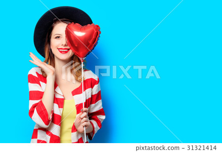 Woman with heart shape toy Woman with heart shape toy 31321414