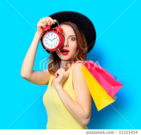 Woman with alarm clock Woman with alarm clock 31321454